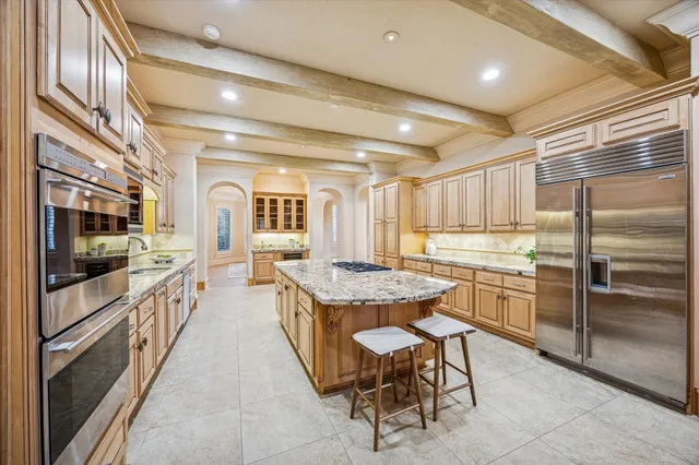 a kitchen with counter top space and stainless steel appliances