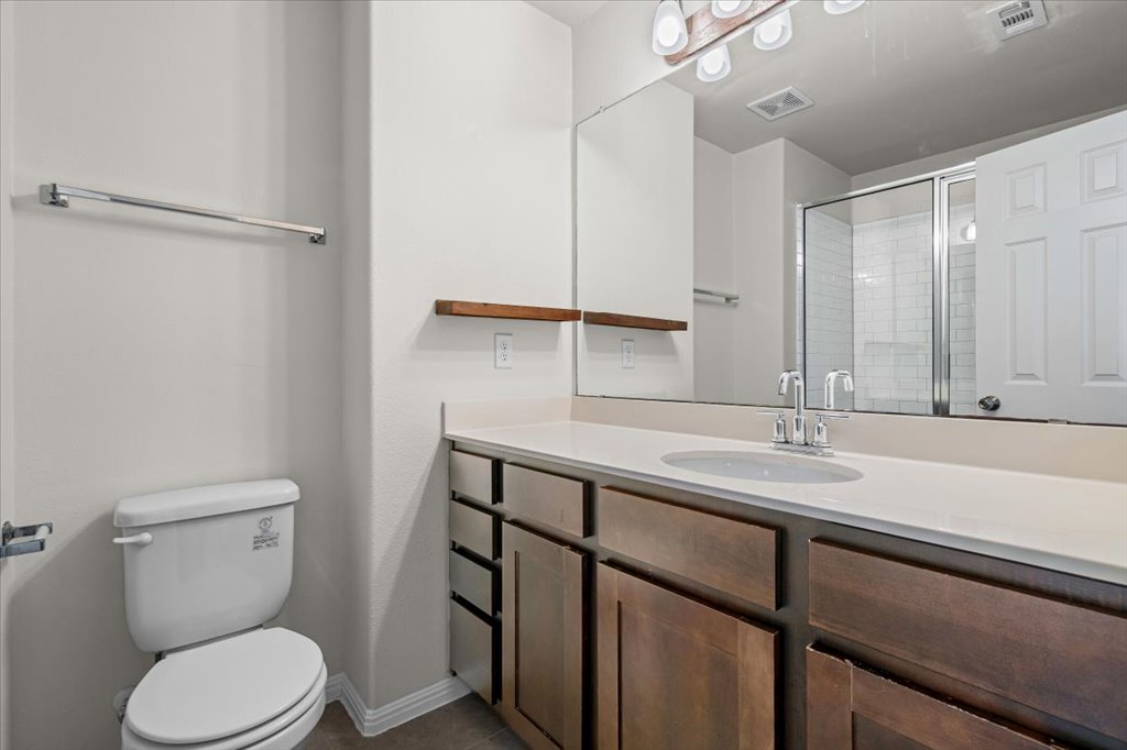1609 Catalan Road, Unit 1802 Austin, TX 78748 - Photo 21 of 25 Full bathroom featuring a stall shower and vanity