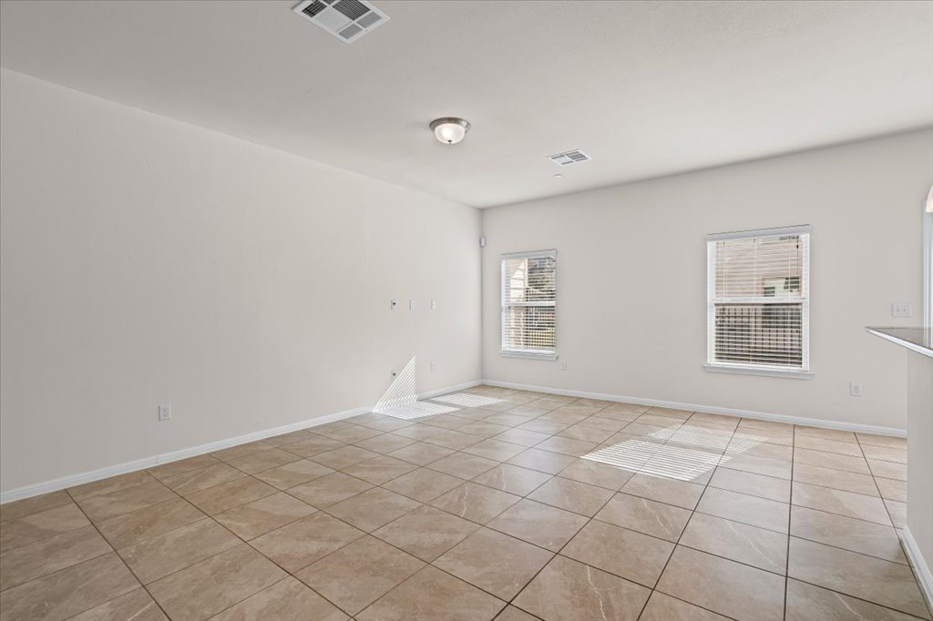 1609 Catalan Road, Unit 1802 Austin, TX 78748 - Photo 4 of 25 Spare room featuring light tile patterned floors and baseboards