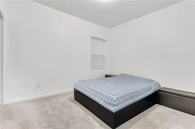 a view of a a dining room with furniture window and wooden floor