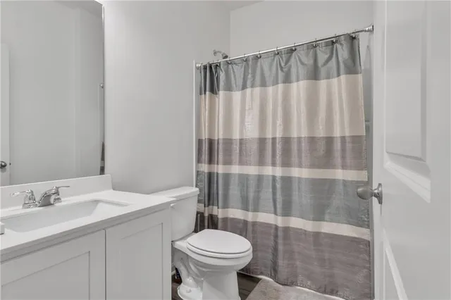 a bedroom with a bed and a chair