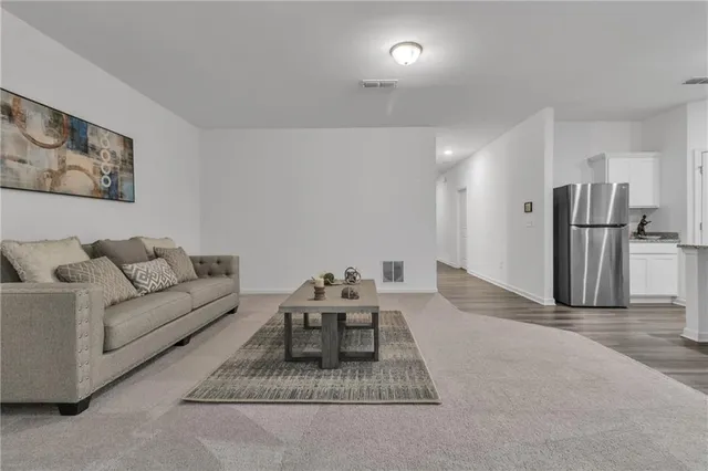 a view of a house with pool and sitting area
