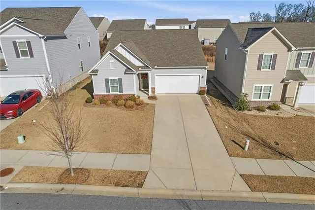 an aerial view of a house with a lake view