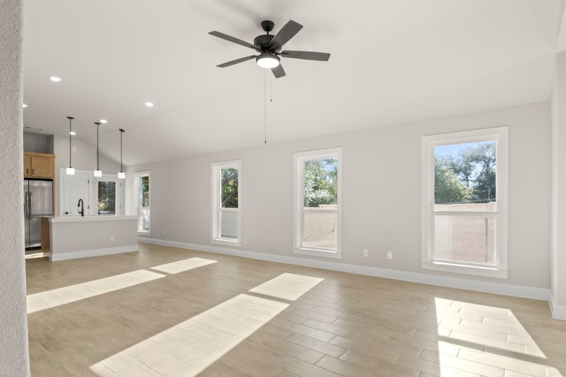 2605 Sam Bass Road, Unit 65 Round Rock, TX 78681 - Photo 13 of 33 a view of livingroom with hardwood floor and a ceiling fan