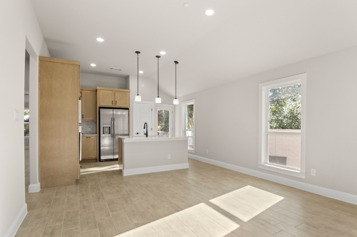 2605 Sam Bass Road, Unit 65 Round Rock, TX 78681 - Photo 14 of 33 a view of kitchen with refrigerator and window