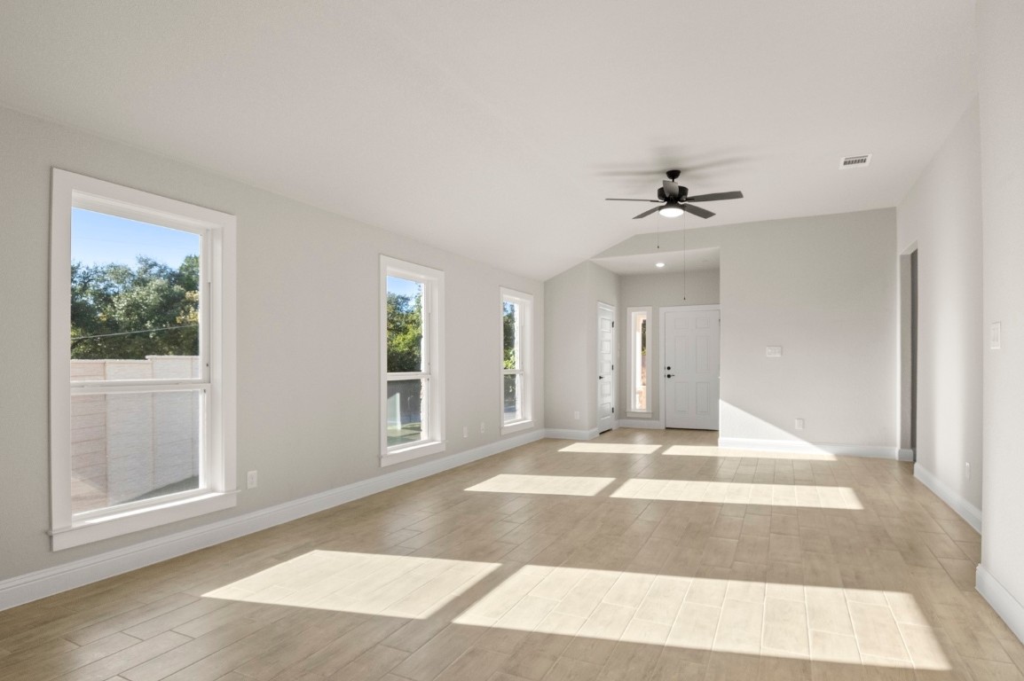 2605 Sam Bass Road, Unit 65 Round Rock, TX 78681 - Photo 17 of 33 a view of an entryway with wooden floor and a livingroom