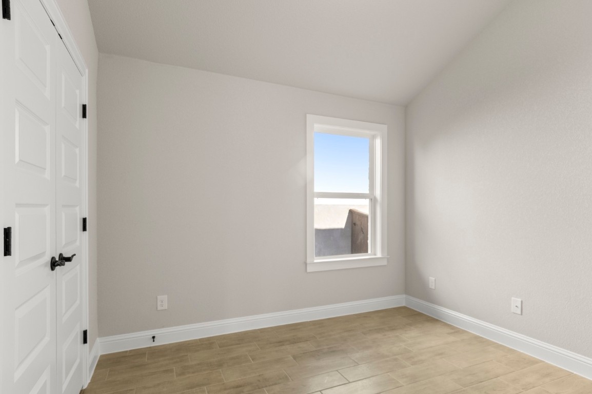 2605 Sam Bass Road, Unit 65 Round Rock, TX 78681 - Photo 29 of 33 an empty room with windows and closet
