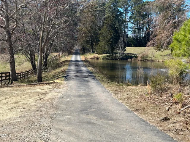 a street sign on a bunch of flowers