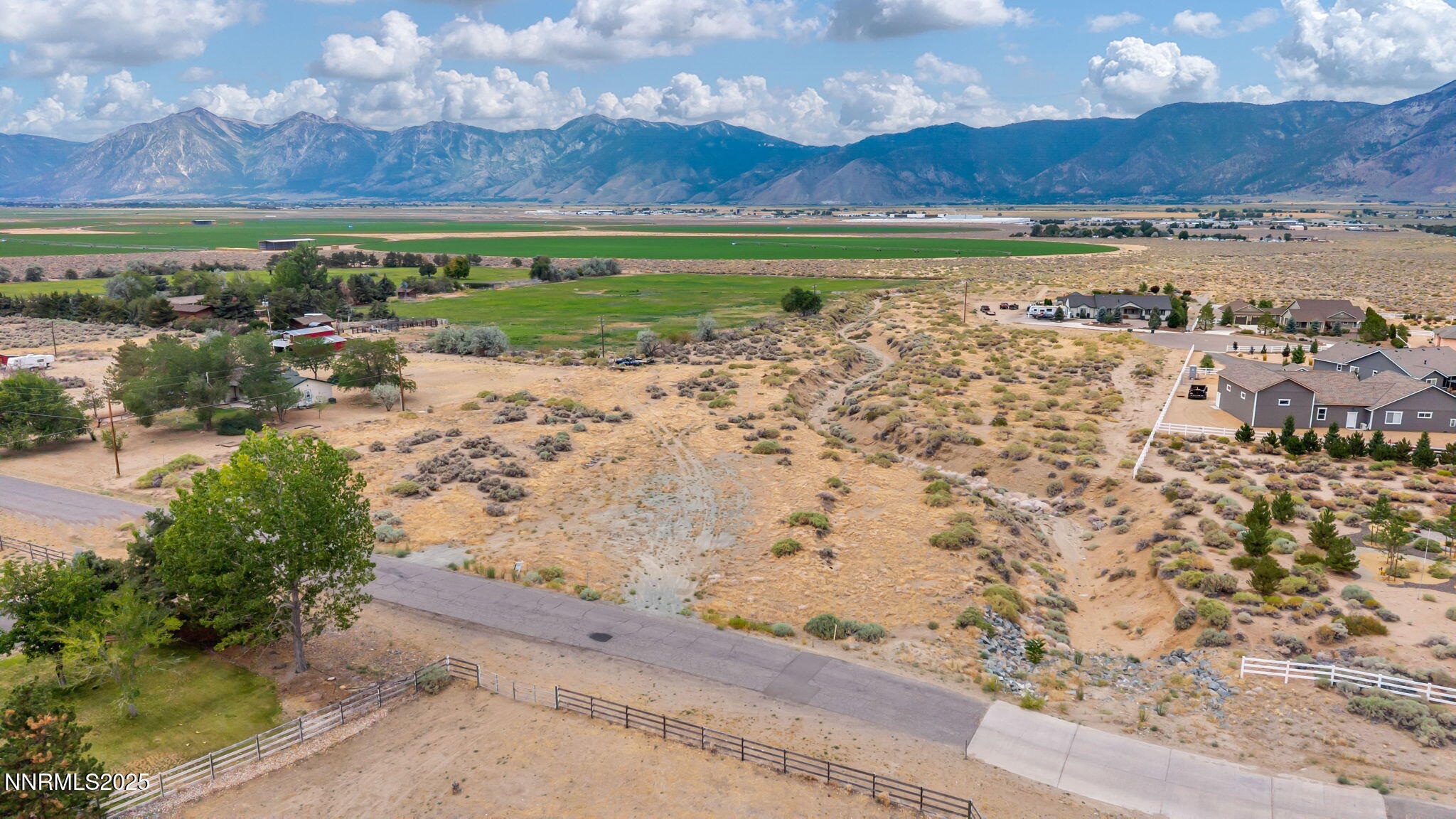 a view of a yard with an ocean view