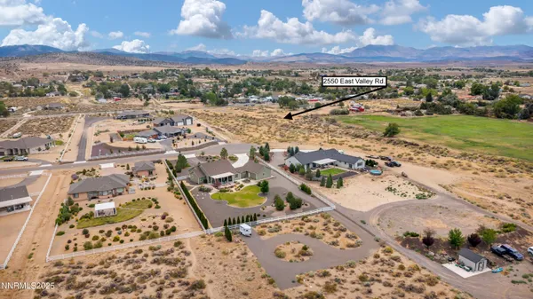an aerial view of residential houses with outdoor space