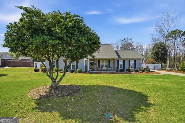 a front view of a house with garden