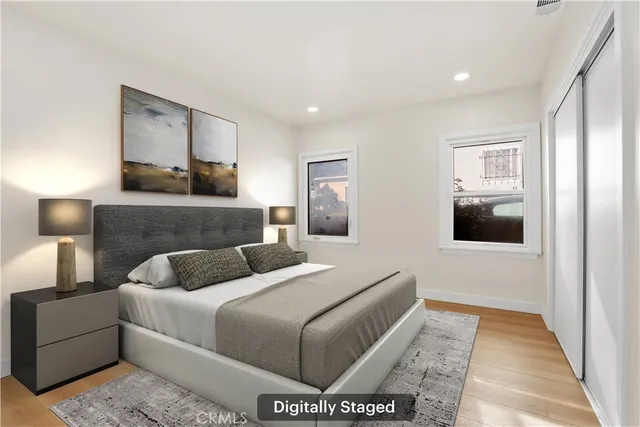 a bedroom with a large bed and a couch