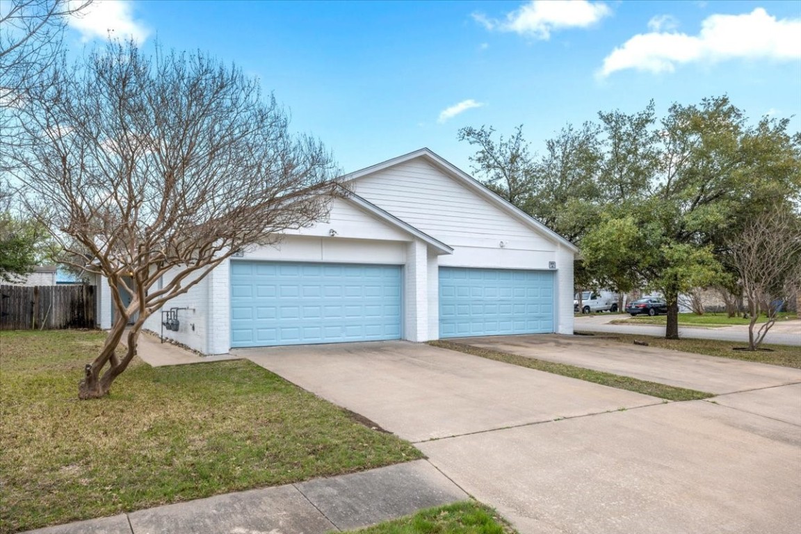 601 Valley View Drive Pflugerville, TX 78660 - Photo 1 of 1 a view of a house with a yard and garage