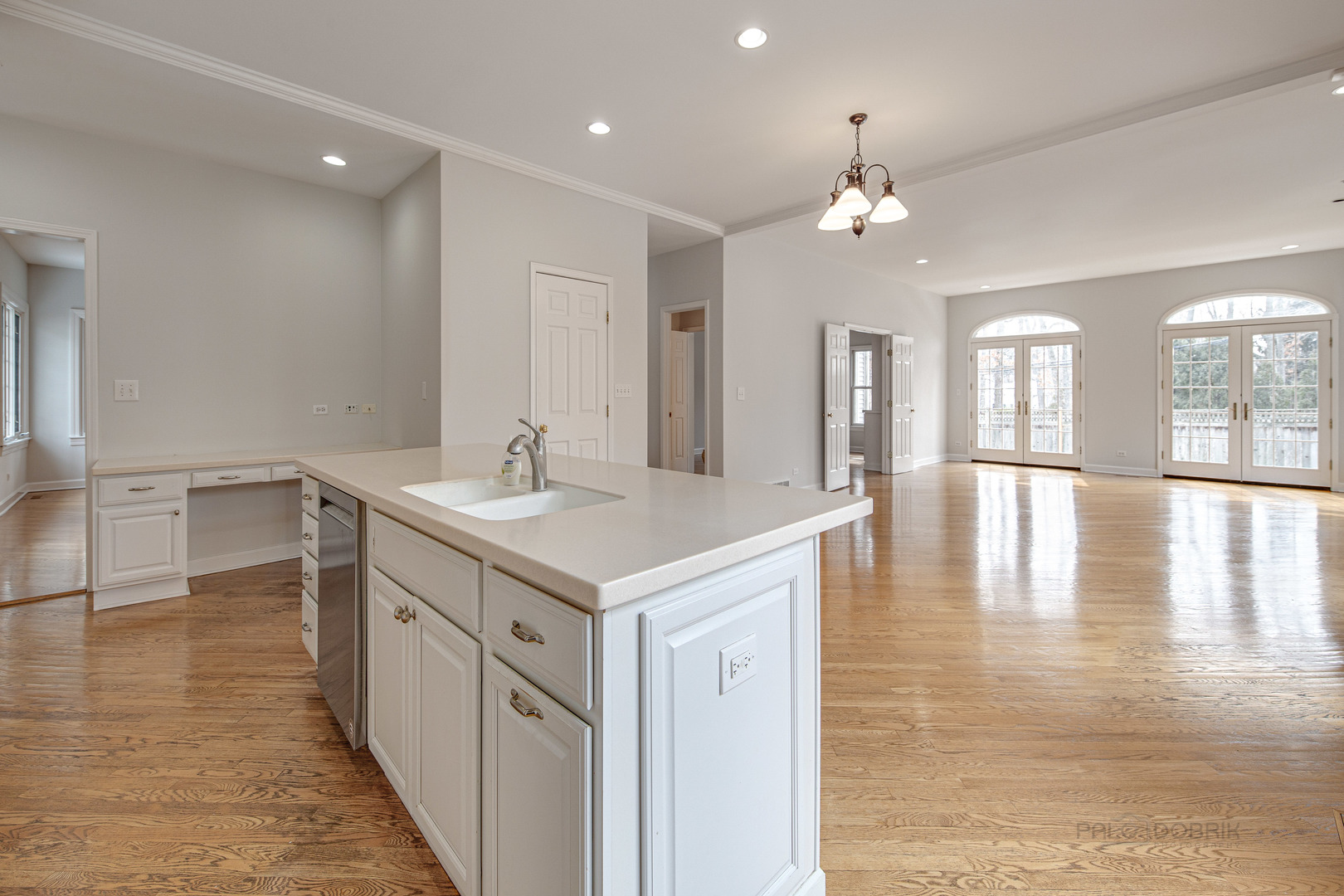 1216 Edgewood Road Lake Forest, IL 60045 - Photo 13 of 35 a kitchen with a sink and chandelier