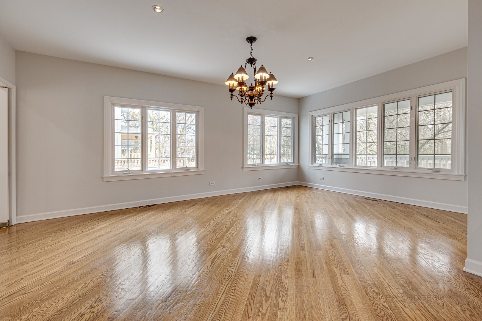 1216 Edgewood Road Lake Forest, IL 60045 - Photo 15 of 35 a view of an empty room with wooden floor and a window