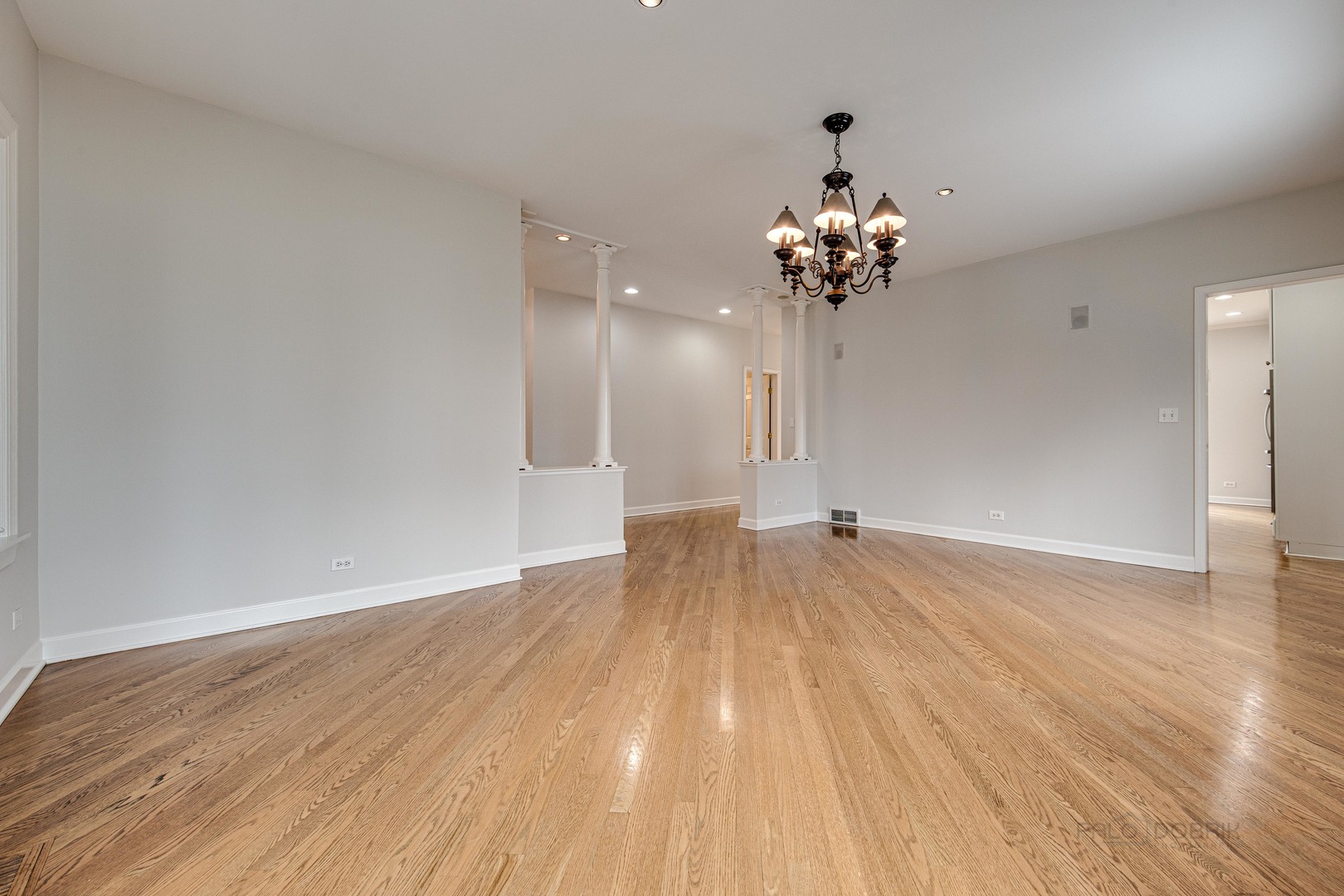 1216 Edgewood Road Lake Forest, IL 60045 - Photo 16 of 35 a view of a room with wooden floor and a chandelier