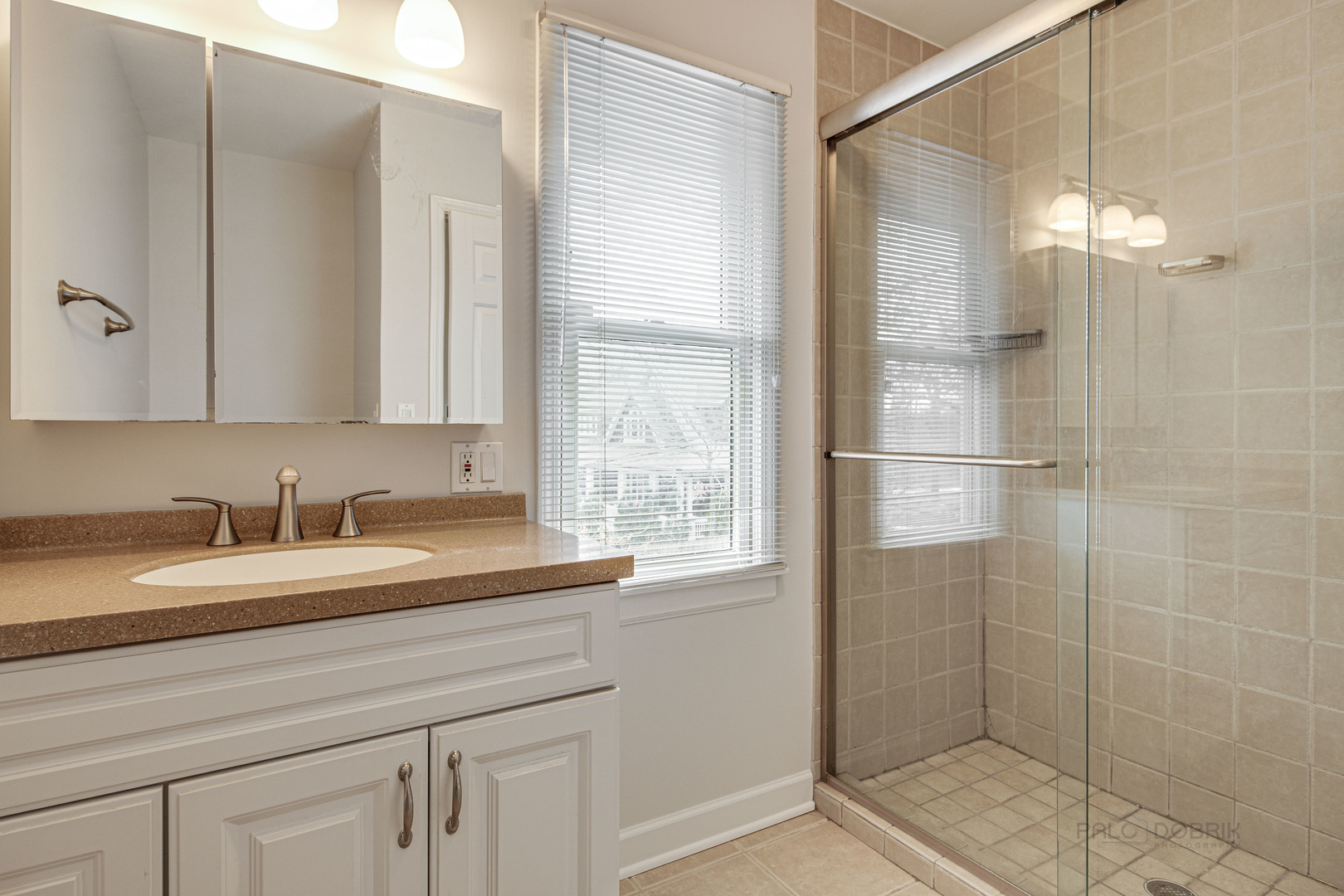 1216 Edgewood Road Lake Forest, IL 60045 - Photo 24 of 35 a bathroom with a granite countertop sink a mirror and a shower