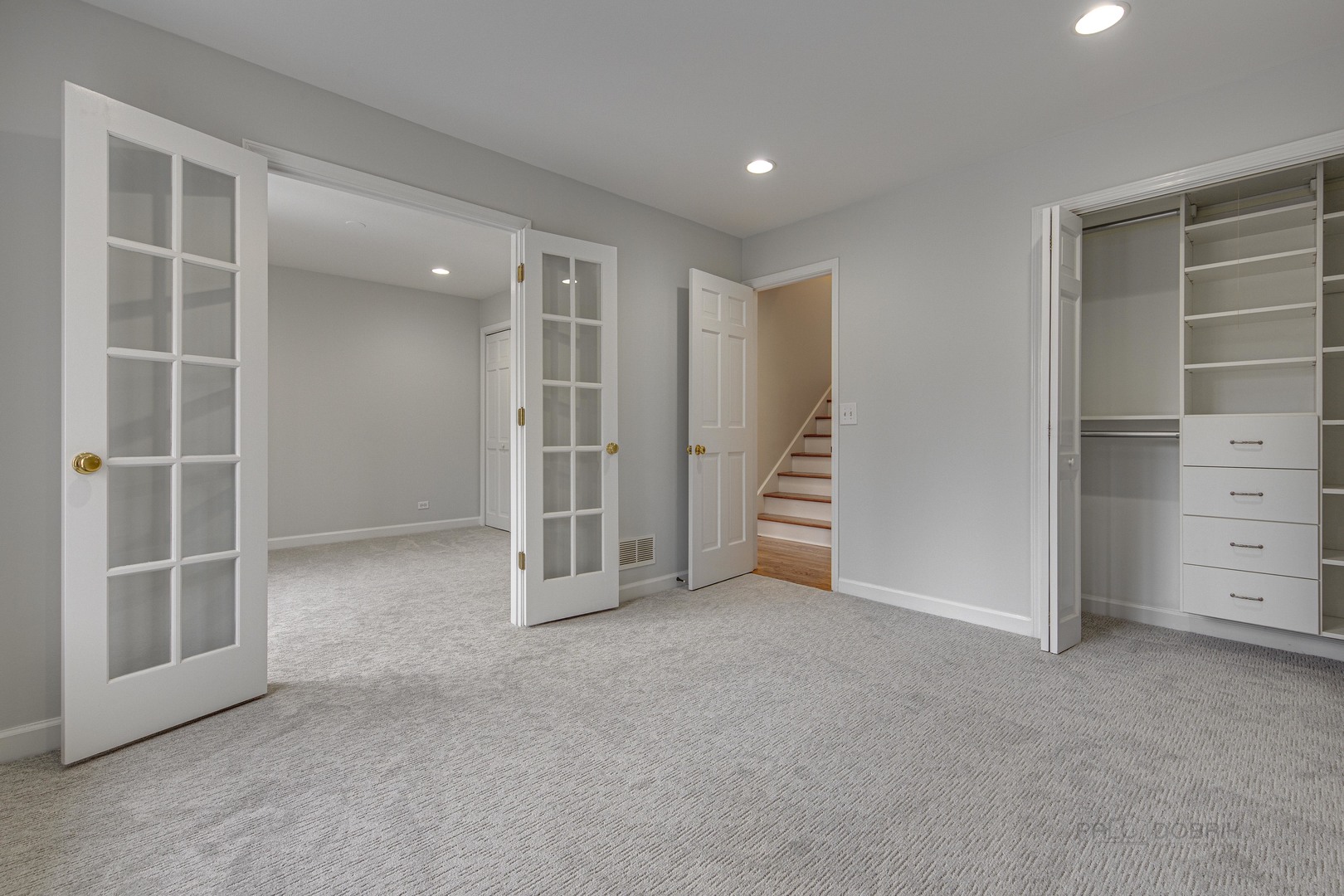 1216 Edgewood Road Lake Forest, IL 60045 - Photo 26 of 35 an empty room with a cabinet and mirrors
