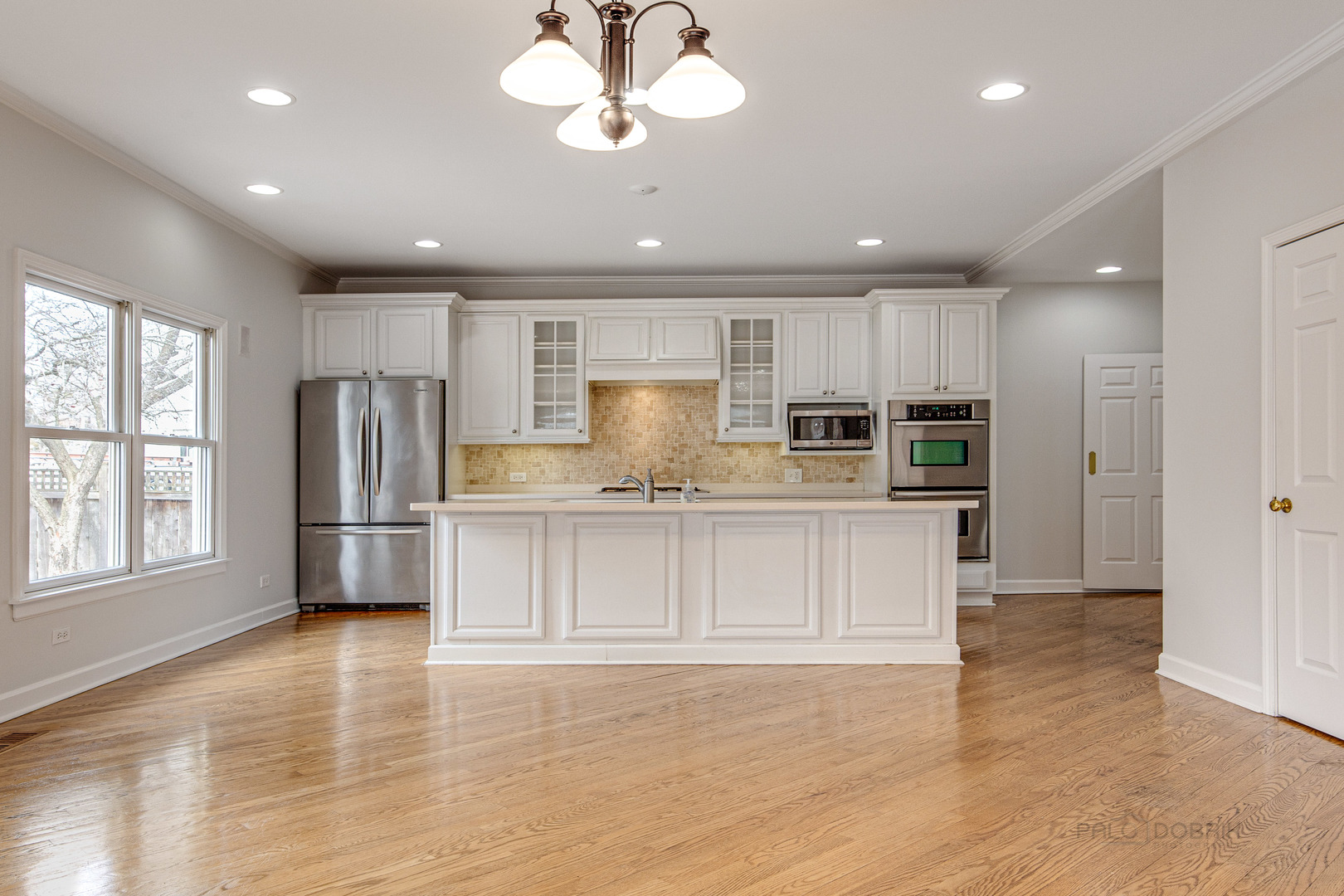 1216 Edgewood Road Lake Forest, IL 60045 - Photo 10 of 35 a kitchen with kitchen island granite countertop appliances cabinets and a counter top space