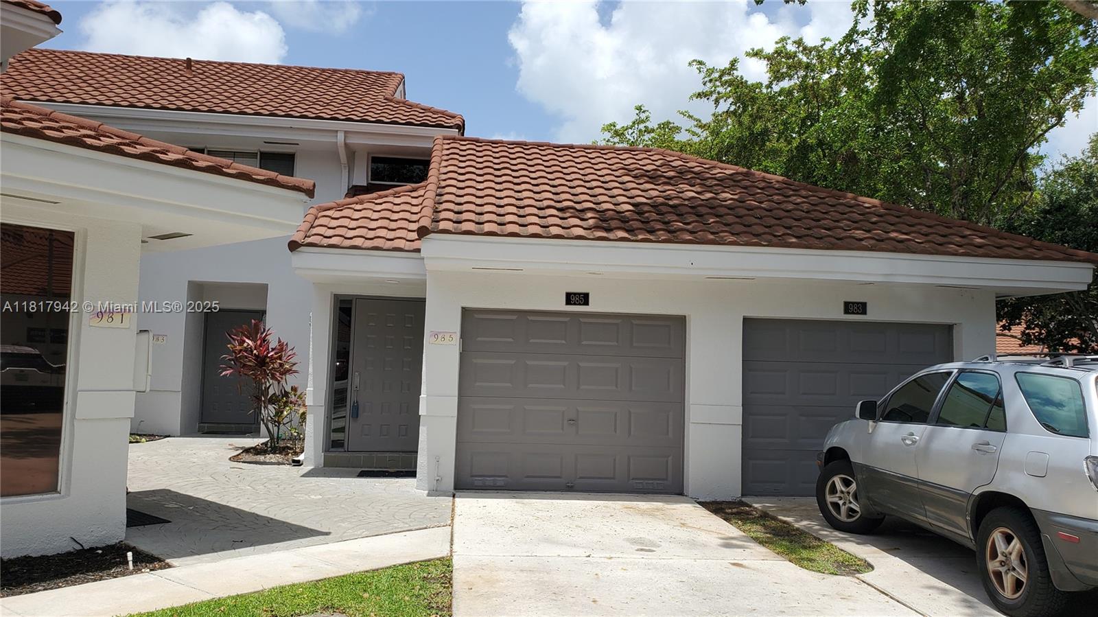a view of a car park in front of house