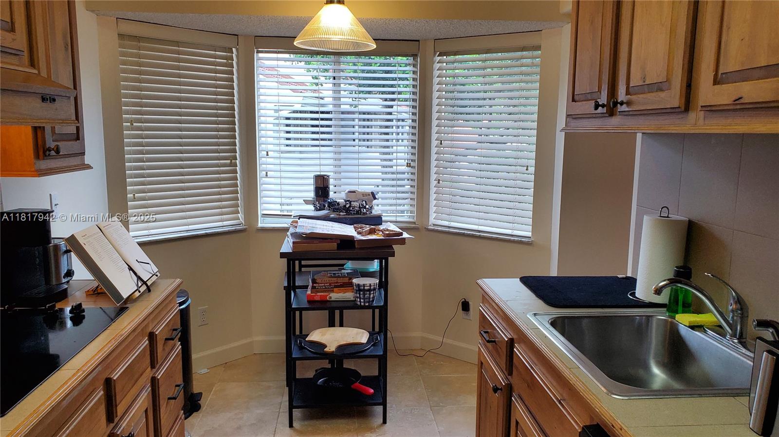 Parc Court Condominiums Plantation, FL 33324 - Photo 12 of 45 a kitchen that has a sink and a stove
