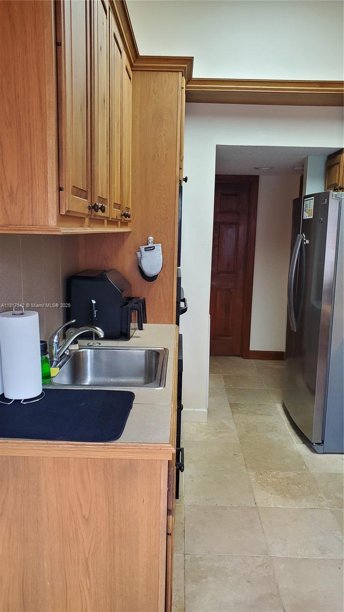 Parc Court Condominiums Plantation, FL 33324 - Photo 13 of 45 a kitchen with a refrigerator and a sink