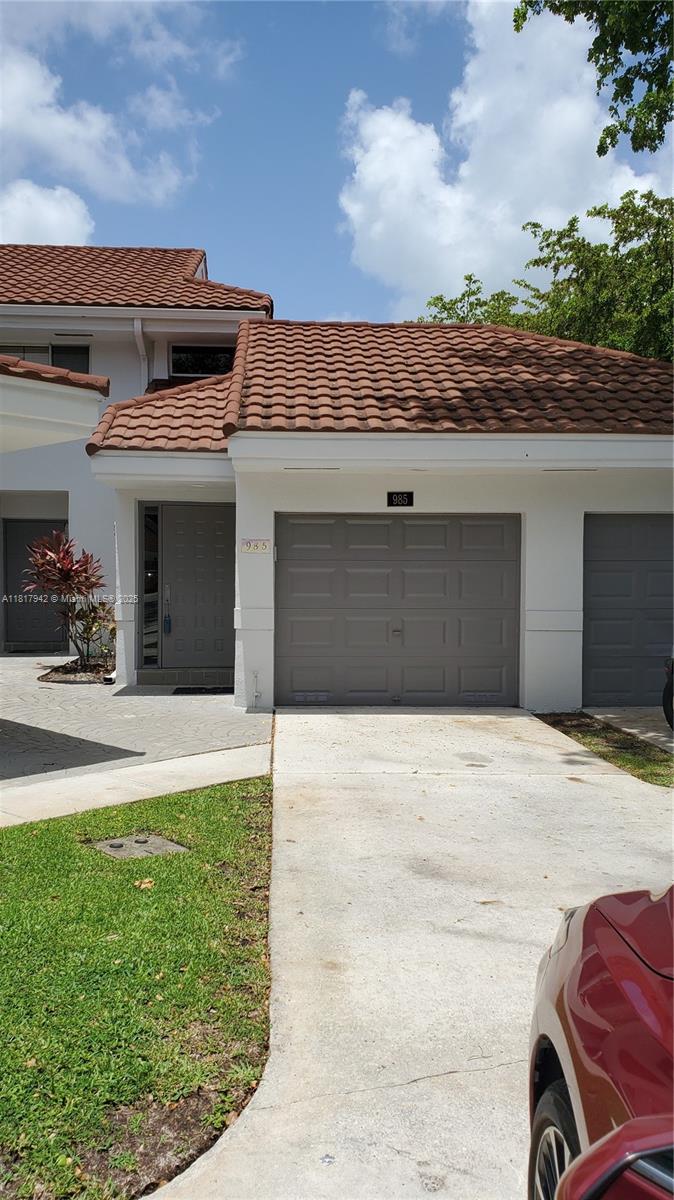 Parc Court Condominiums Plantation, FL 33324 - Photo 7 of 45 a front view of a house with a yard