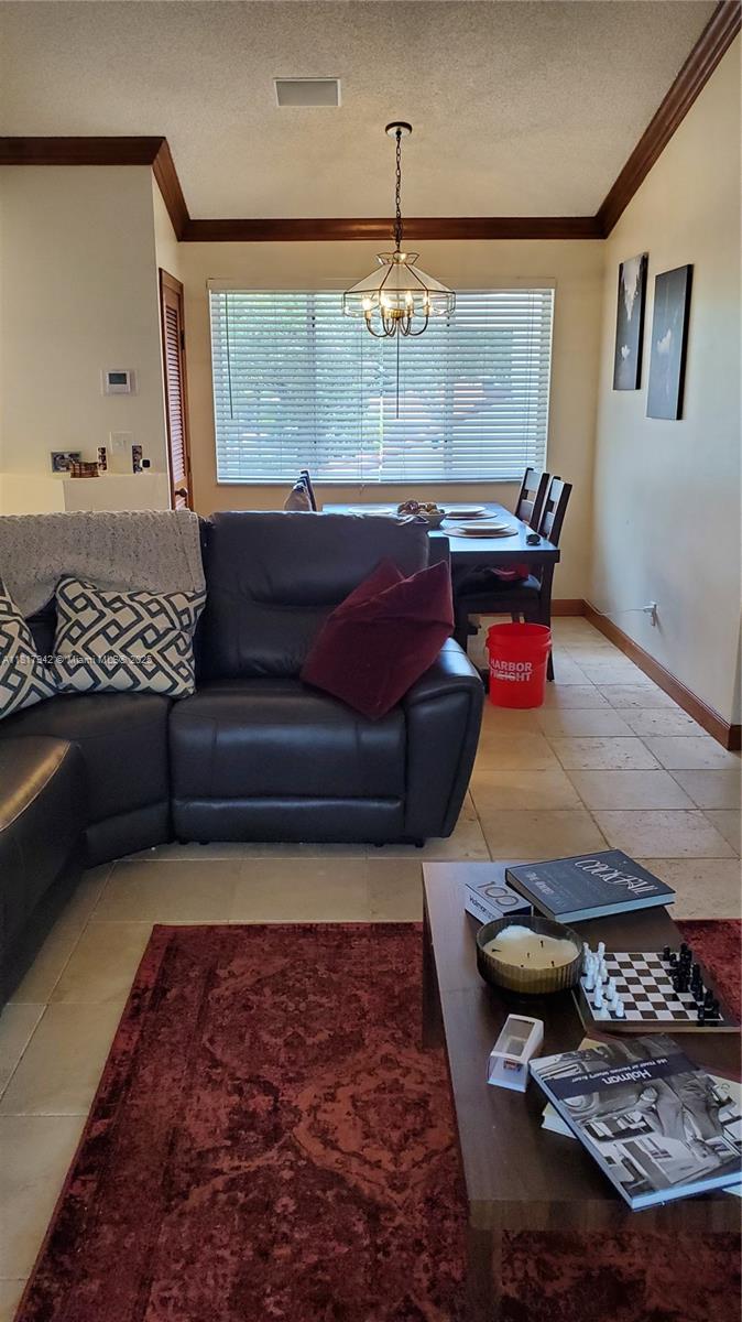 Parc Court Condominiums Plantation, FL 33324 - Photo 8 of 45 a living room with furniture and a chandelier