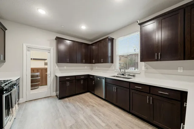 a kitchen with a sink and cabinets