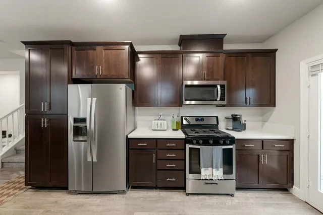 a utility room with sink dryer and washer