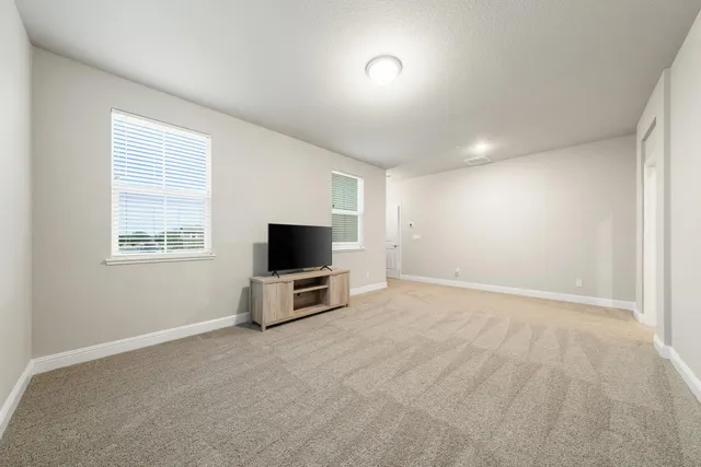 a bathroom with a double vanity sink mirror and shower
