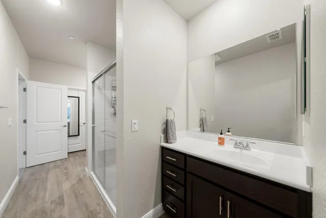 a bathroom with a shower and toilet