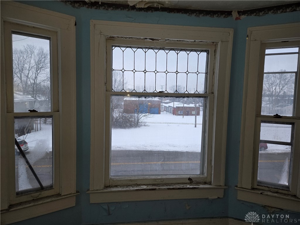 727 West High Street Springfield, OH 45506 - Photo 12 of 29 This interior view features multiple windows offering expansive neighborhood views.