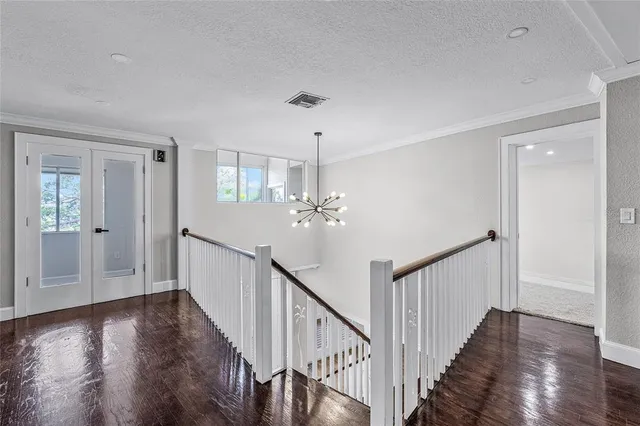 a view of a hallway with windows