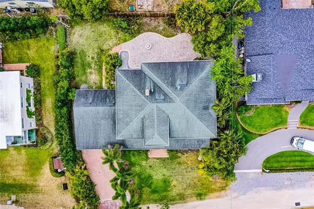 an aerial view of a house with a garden