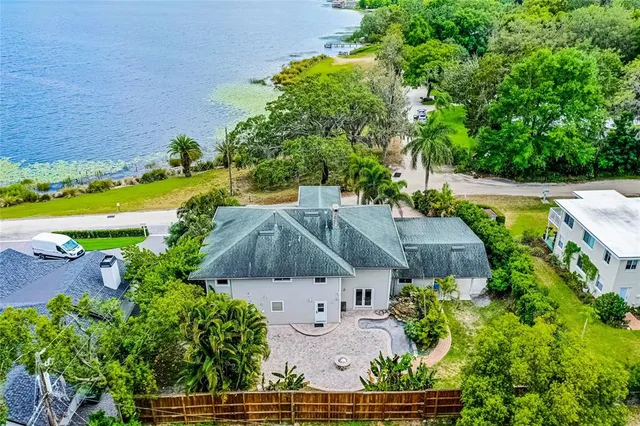 an aerial view of multiple houses with yard