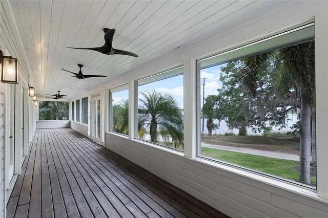 a view of a porch with wooden floor and outdoor space