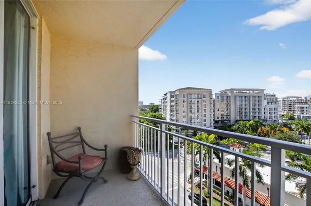 a view of a chair and table in the balcony
