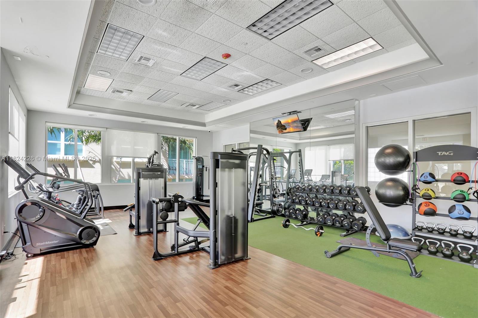 99 Southeast Mizner Boulevard, Unit 821 Boca Raton, FL 33432 - Photo 22 of 23 a view of a room with gym equipment