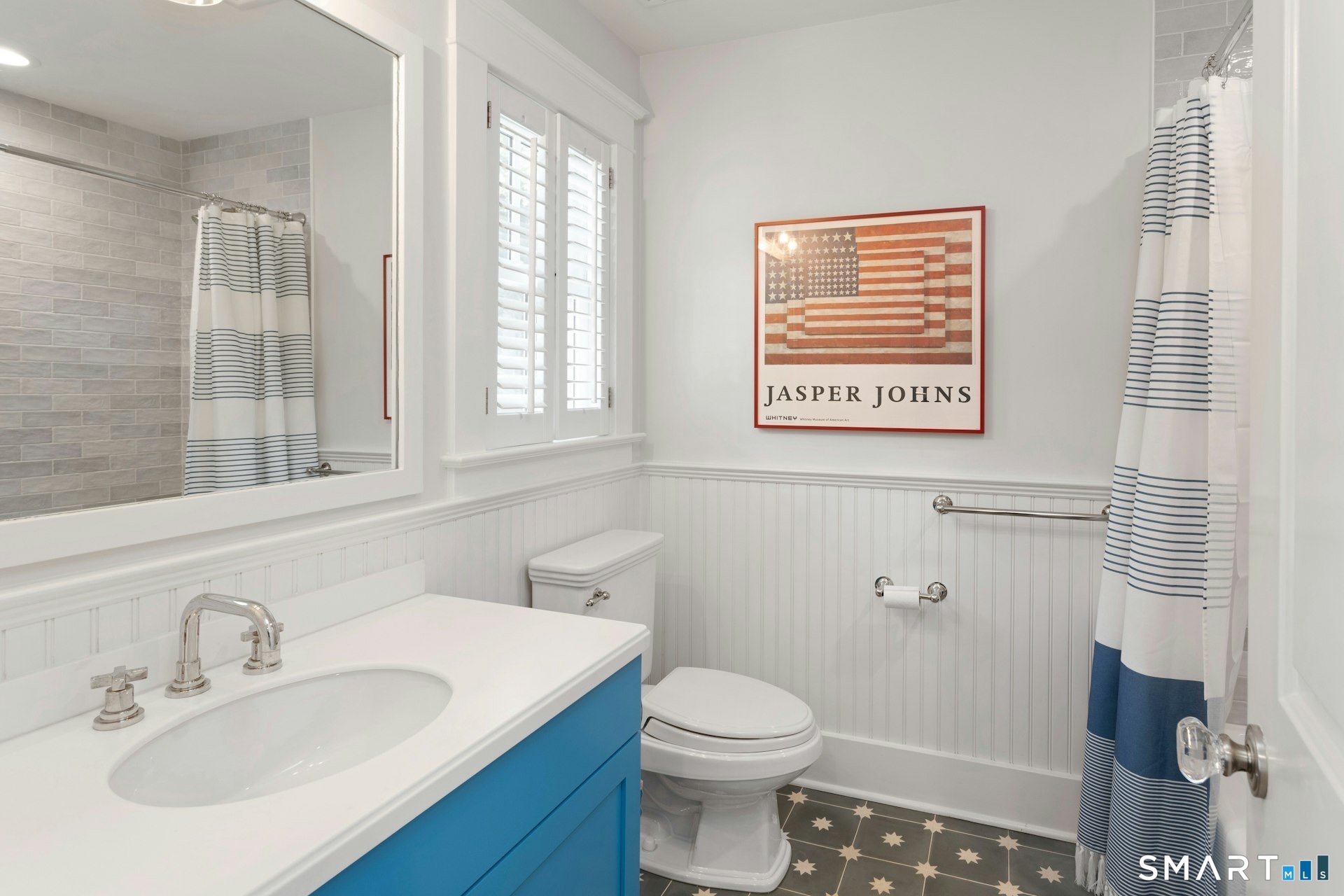 2 Roland Drive Darien, CT 06820 - Photo 25 of 40 a bathroom with a sink a toilet and a mirror