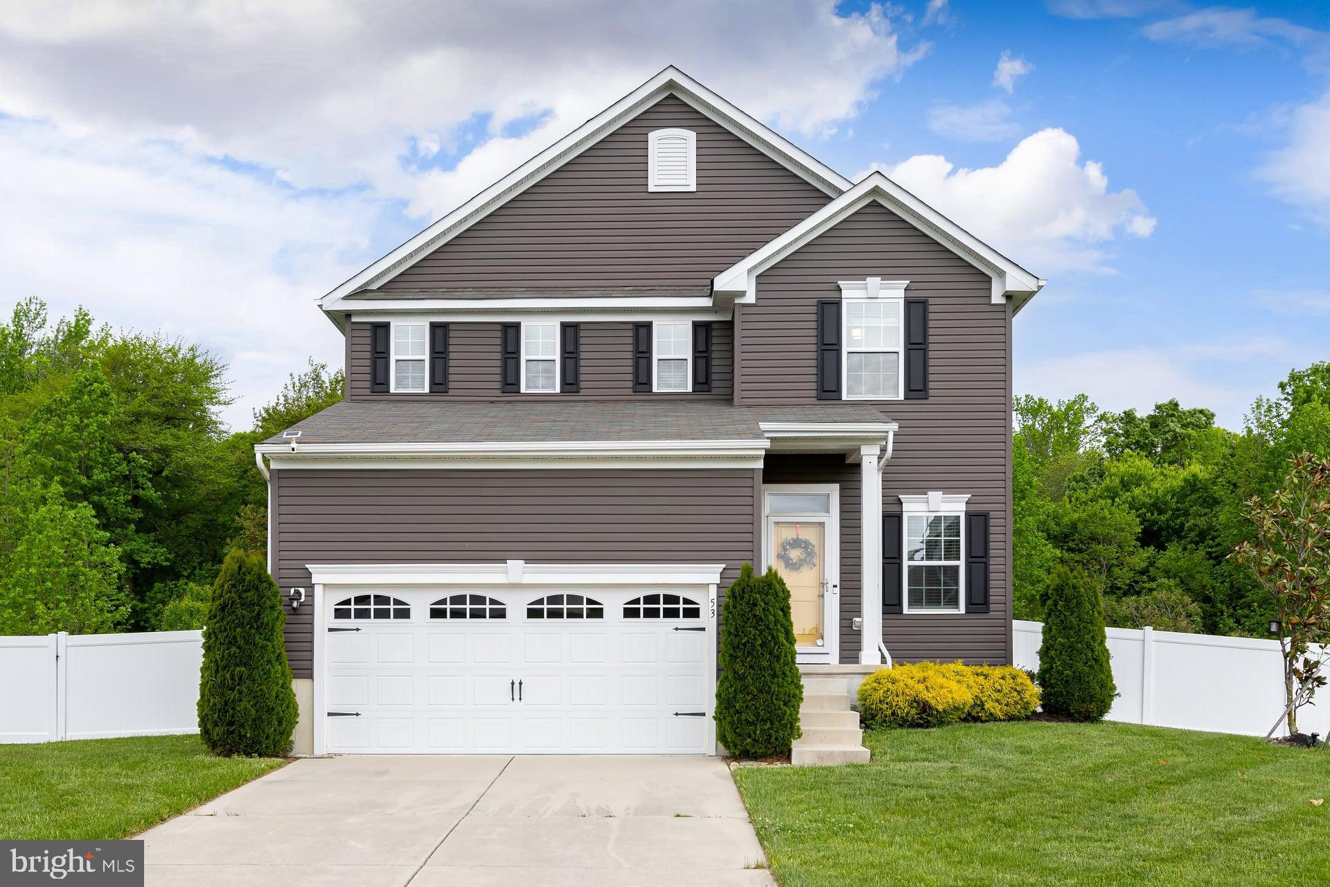 53 Oak Ln. Carneys Point, NJ 08069 - Photo 1 of 28 a front view of a house with a yard