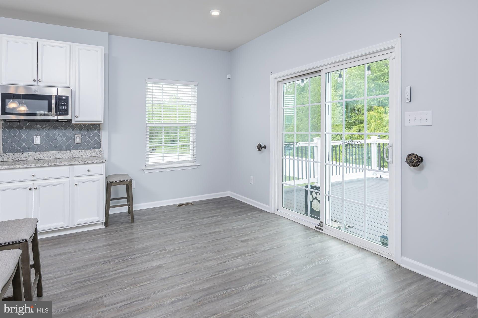 53 Oak Ln. Carneys Point, NJ 08069 - Photo 11 of 28 a view of wooden floor and windows in a room