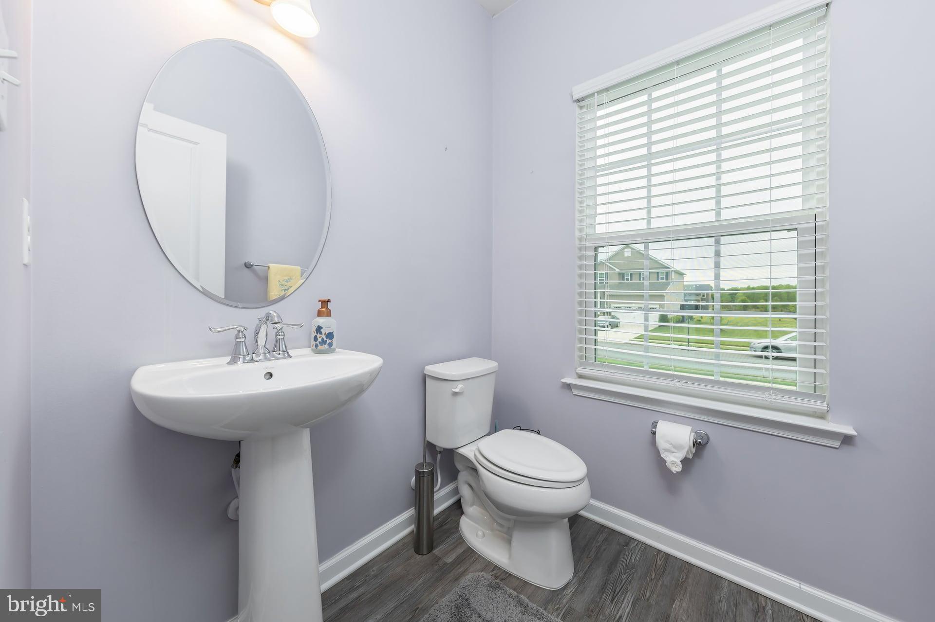 53 Oak Ln. Carneys Point, NJ 08069 - Photo 12 of 28 a bathroom with a sink toilet and a mirror