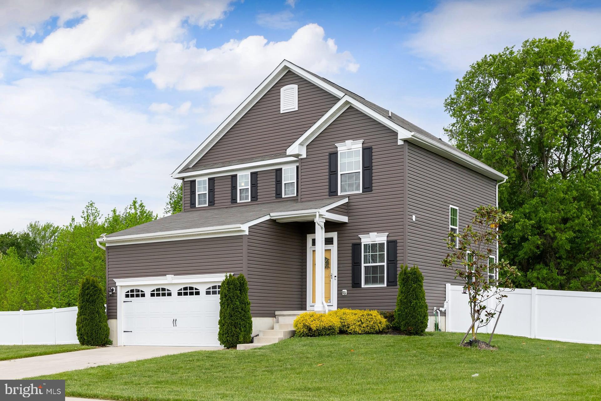 53 Oak Ln. Carneys Point, NJ 08069 - Photo 2 of 28 a front view of a house with a yard