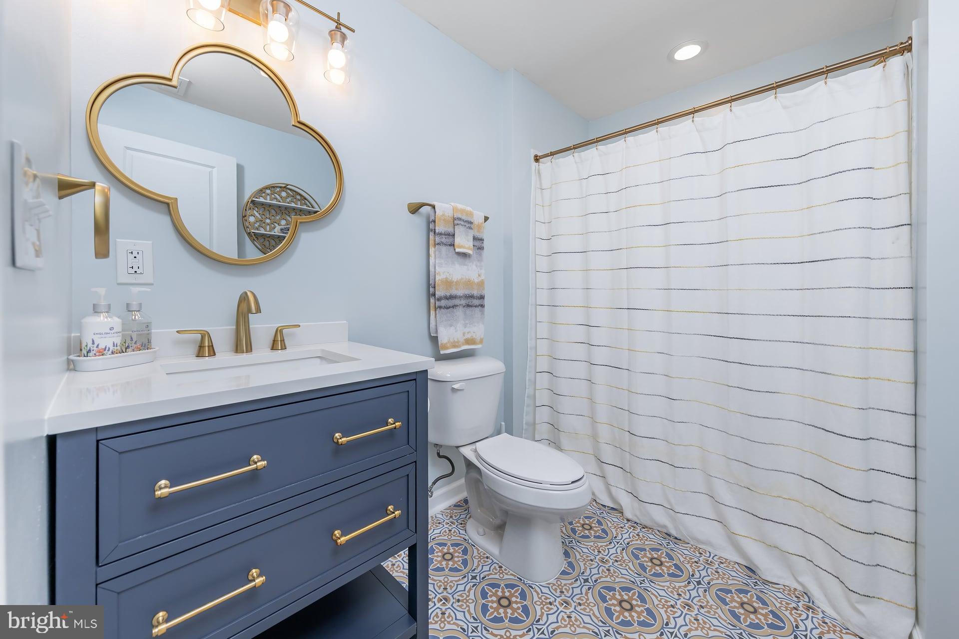 53 Oak Ln. Carneys Point, NJ 08069 - Photo 23 of 28 a bathroom with a sink a toilet and a mirror