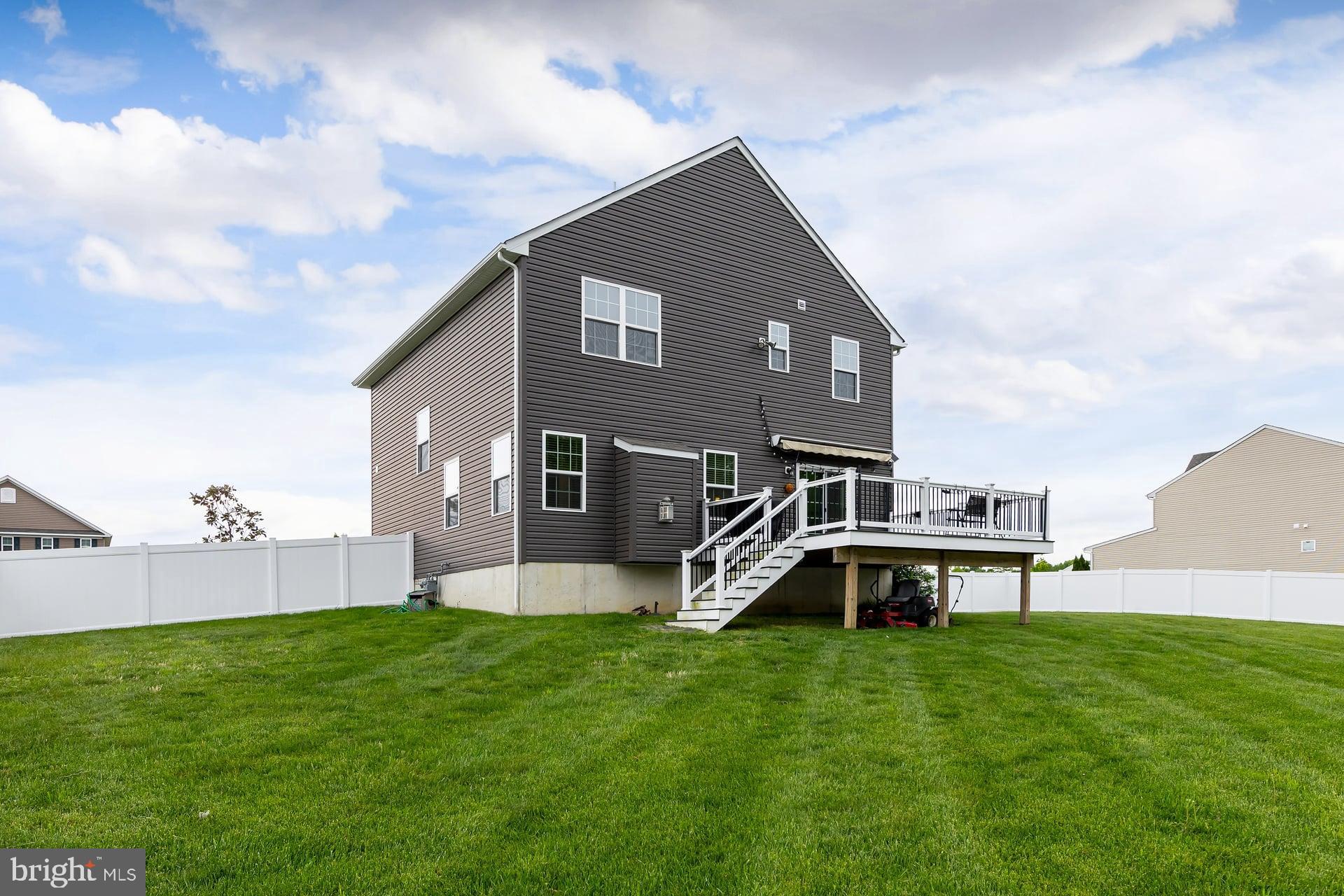 53 Oak Ln. Carneys Point, NJ 08069 - Photo 25 of 28 a front view of a house with garden