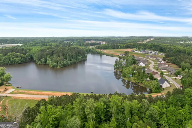 an aerial view of city and lake