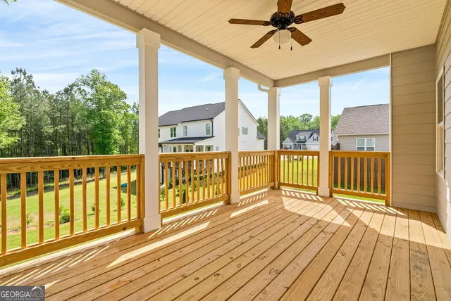 a view of a balcony with wooden floor