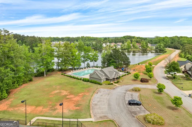 a view of a swimming pool with a yard