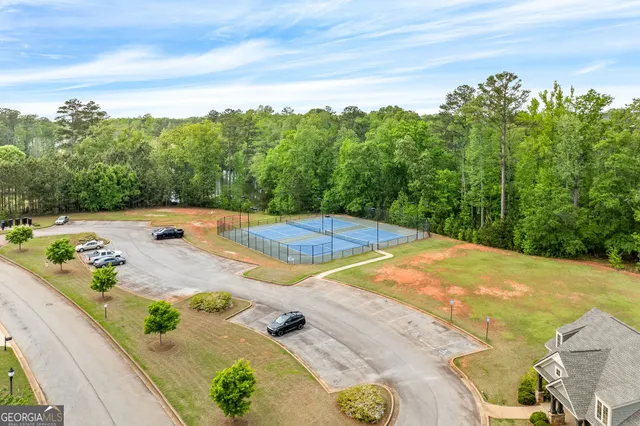 a view of a swimming pool with an outdoor space and seating area
